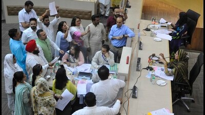 AAP and BJP councillors arguing in the well of the Chandigarh MC House on Thursday (Keshav Singh/HT) AAP and BJP councillors arguing in the well of the Chandigarh MC House on Thursday (Keshav Singh/HT)