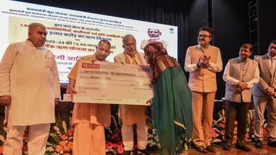 Uttar Pradesh chief minister Yogi Adityanath at a loan mela. (PTI PHOTO)