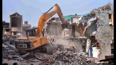 Bulldozer being used to demolish the ‘illegally constructed’ residence of Javed, a local leader who was allegedly the key conspirator of violent protests in Prayagraj. (PTI file Photo)