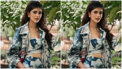 In golden ear studs and a neck chain with a golden pendant from the house of Karishma Joolry, Sanjana further accessorised her look. (Instagram/@sanjanasanghi96)