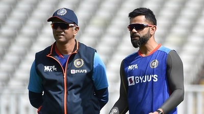 India's Virat Kohli, right, interacts with head coach Rahul Dravid during a training session ahead of the fifth cricket test match between England and India at Edgbaston in Birmingham (AP)