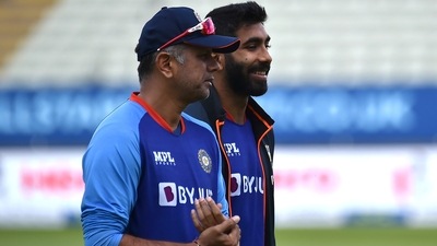 Jasprit Bumrah (right) and coach Rahul Dravid inspect the pitch during a training session ahead of the 5th Test against England at Edgbaston (AP) Jasprit Bumrah (right) and coach Rahul Dravid inspect the pitch during a training session ahead of the 5th Test against England at Edgbaston (AP)