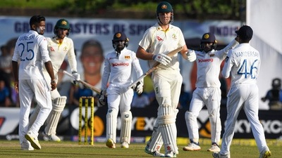 Sri Lanka's Ramesh Mendis (L) celebrates with teammates after taking the wicket of Australia's Cameron Green (3R) (AFP) Sri Lanka's Ramesh Mendis (L) celebrates with teammates after taking the wicket of Australia's Cameron Green (3R) (AFP)