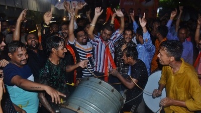 Shinde supporters play drums and dance to celebrate their leader's elevation to the chief minister's post. (( Praful Gangurde / HT Photo))