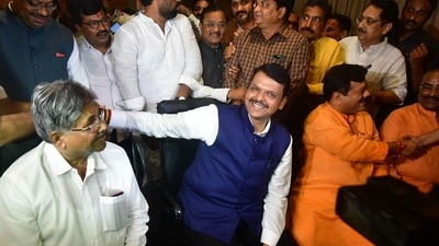 Celebration began at the BJP camp as soon as Uddhav Thackeray resigned from the CM post. (PTI) Celebration began at the BJP camp as soon as Uddhav Thackeray resigned from the CM post. (PTI)