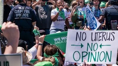 Abortion-rights activists demonstrate against the Supreme Court decision to overturn Roe v. Wade on Capitol Hill in Washington. (AP) Abortion-rights activists demonstrate against the Supreme Court decision to overturn Roe v. Wade on Capitol Hill in Washington. (AP)