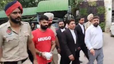 Jagdeep Singh alias Jaggu Bhagwanpuria being brought on transit remand to Punjab on Wednesday. (HT File) Jagdeep Singh alias Jaggu Bhagwanpuria being brought on transit remand to Punjab on Wednesday. (HT File)
