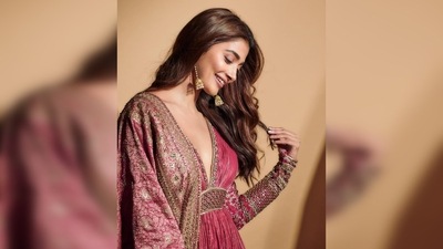 Pooja Hegde's anarkali featured a plunging neckline and intricate sequins work on textured material. (Instagram/@hegdepooja)