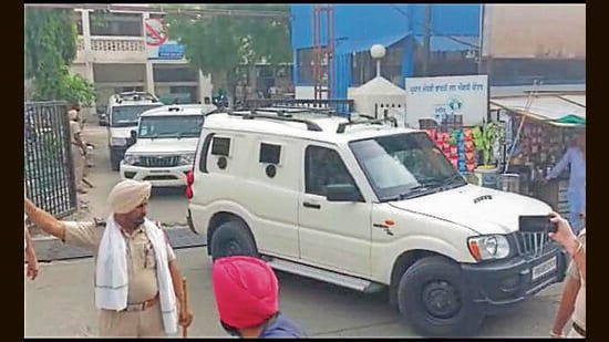 Jagdeep Singh, alias Jaggu Bhagwanpuria, being taken away from court in Mansa on Thursday. (SANJEEV KUMAR/HT)