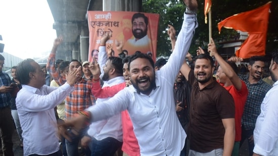 Supporters celebrate after Eknath Shinde was anointed the chief minister of Maharashtra(( Praful Gangurde / HT Photo))