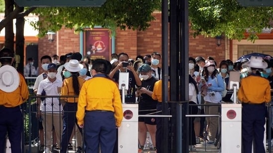 Visitors line up up at the Shanghai Disney Resort, as the Shanghai Disneyland theme park prepares to reopen after being shut for Covid outbreak, on June 30, 2022.&nbsp;(Reuters )