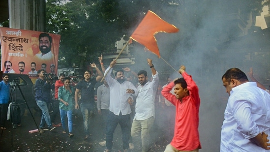 Supporters of Eknath Shinde rejoice after he took oath as the new chief minister of Maharashtra.(PTI)