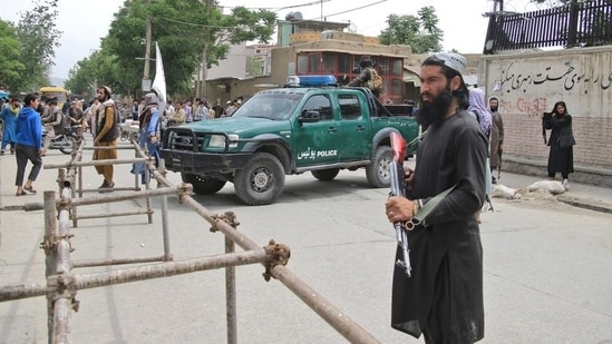 Taliban fighters stand guard in Kabul, the capital city of Afghanistan.(Reuters)