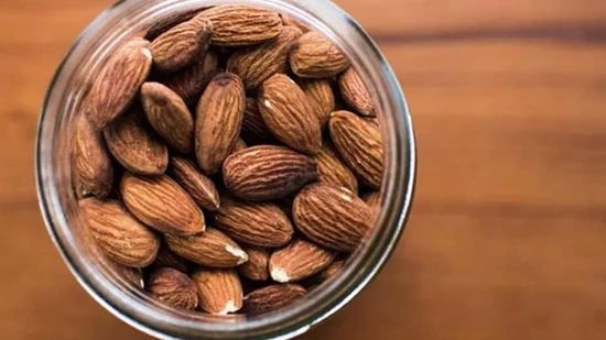 Almonds: Almonds are full of fibre and good fats which helps to prevent chronic disease. Almonds are a good source of magnesium, which is needed to regulate sleep-promoting melatonin. Magnesium also relaxes your muscles.(Unsplash)