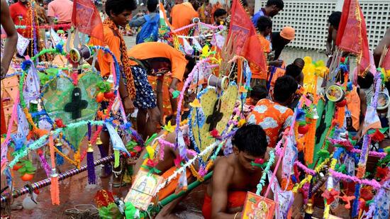 Lord Shiva devotees, kanwariyas, undertake an ardous trek from Haridwar on the first day of Shravan month to shrines in their localities. (HT File Photo)