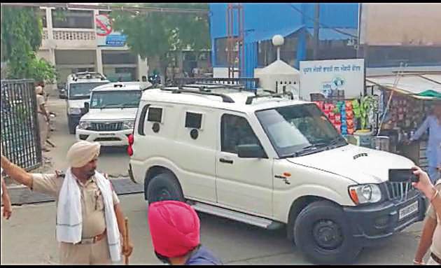 Jagdeep Singh, alias Jaggu Bhagwanpuria, being taken away from court in Mansa on Thursday. (SANJEEV KUMAR/HT) Jagdeep Singh, alias Jaggu Bhagwanpuria, being taken away from court in Mansa on Thursday. (SANJEEV KUMAR/HT)