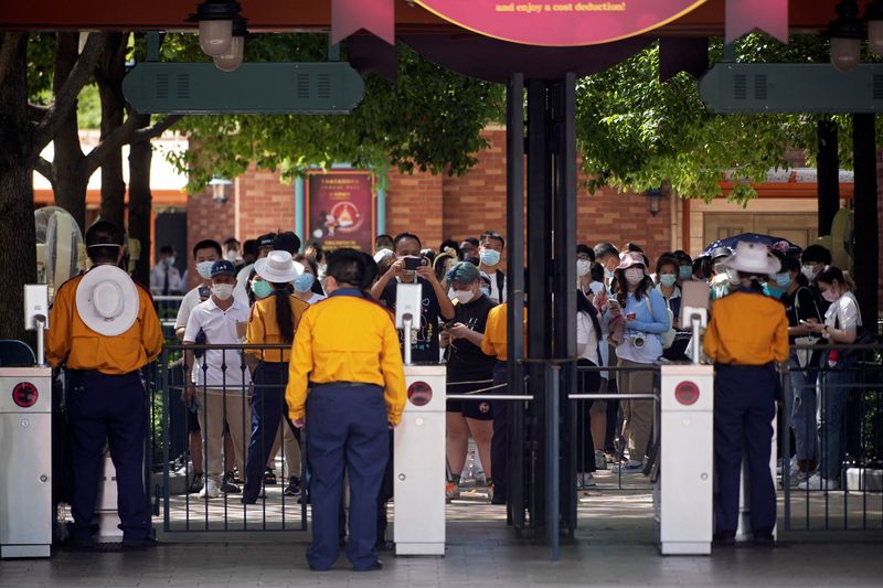 Visitors line up up at the Shanghai Disney Resort, as the Shanghai Disneyland theme park prepares to reopen after being shut for Covid outbreak, on June 30, 2022.&nbsp; (Reuters )