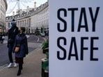 File photo: People wear face masks as they walk, in Regent Street, in London. File photo: People wear face masks as they walk, in Regent Street, in London. 