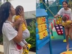 Shriya Saran playing with daughter Radha in the rain. Shriya Saran playing with daughter Radha in the rain.