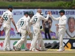 Australia's team members congratulate their bowler Nathan Lyon, second right, for the dismissal of Sri Lanka's Kusal Mendis, right, during the day three of the first test cricket match between Australia and Sri Lanka in Galle.(AP) Australia's team members congratulate their bowler Nathan Lyon, second right, for the dismissal of Sri Lanka's Kusal Mendis, right, during the day three of the first test cricket match between Australia and Sri Lanka in Galle.(AP)