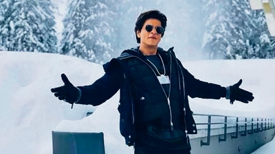 SRK at Davos. When Shah Rukh Khan stretches his arms out in that signature pose, it feels like he is embracing the world, Chopra says. SRK at Davos. When Shah Rukh Khan stretches his arms out in that signature pose, it feels like he is embracing the world, Chopra says.