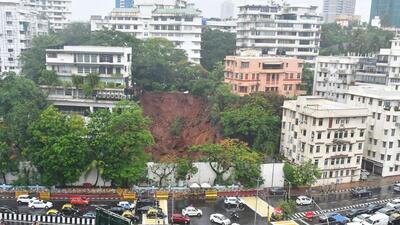 Mumbai, India - July 01, 2022: Trees on a hill come sliding down along with the rubble after incessant rains cause landslide near an under-construction building on Thursday night at Peddar Road, in Mumbai, India, on Friday. (Photo by BhushanKoyande/HT Photo)