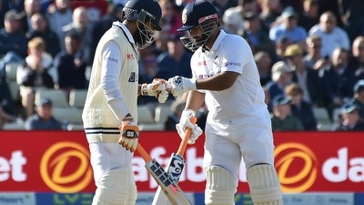 India's Rishabh Pant, right, fist bumps with batting partner Ravindra Jadeja after scoring runs during the first day of the fifth cricket Test match (AP)