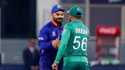 Virat Kohli (L) with Babar Azam (AP) Virat Kohli (L) with Babar Azam (AP)