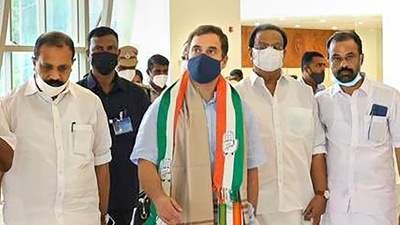 Congress leader Rahul Gandhi being received by party leaders upon his arrival at the Kannur International Airport, in Kannur, Friday. (PTI)