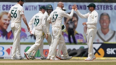 Australia's team members congratulate their bowler Nathan Lyon, second right, for the dismissal of Sri Lanka's Kusal Mendis, right, during the day three of the first test cricket match between Australia and Sri Lanka in Galle. (AP) Australia's team members congratulate their bowler Nathan Lyon, second right, for the dismissal of Sri Lanka's Kusal Mendis, right, during the day three of the first test cricket match between Australia and Sri Lanka in Galle. (AP)