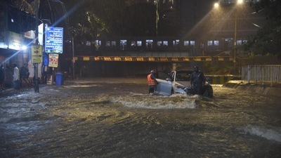 People were seen wading through knee-deep water at several locations and scores of motorists were stuck in traffic snarls for hours. (HT Photo/Vijay Bate)