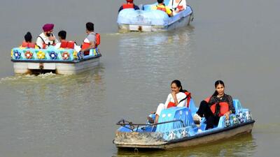 Visitors enjoying the weather at Sukhna Lake in Chandigarh on Friday. (Keshav Singh/HT)