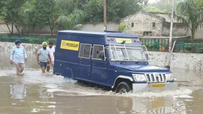 A cash van that was stuck in a waterlogged stretch in Bathinda after the first monsoon rain on Friday morning. (Sanjeev Kumar/HT)