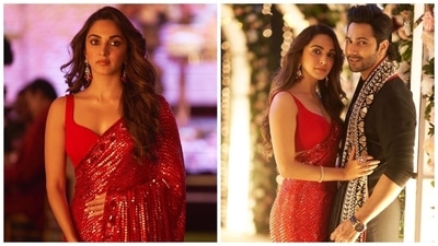 Kiara Advani served a head-turning fashion moment in this red embellished saree by Manish Malhotra. The actor's six yards comes adorned in shimmering red sequins teamed with a sleeveless blouse featuring a sweetheart neckline and a midriff-baring cropped hem. She accessorised the look with an ogle-worthy assemblage of jewels, including a sleek bracelet, a statement ring and dainty ear drop jhumkis. (Instagram) Kiara Advani served a head-turning fashion moment in this red embellished saree by Manish Malhotra. The actor's six yards comes adorned in shimmering red sequins teamed with a sleeveless blouse featuring a sweetheart neckline and a midriff-baring cropped hem. She accessorised the look with an ogle-worthy assemblage of jewels, including a sleek bracelet, a statement ring and dainty ear drop jhumkis. (Instagram)