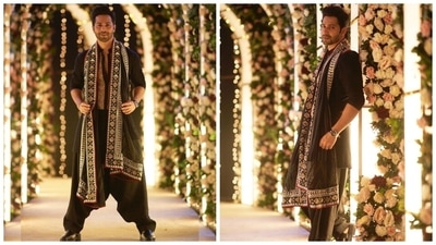 Varun also wore a custom Manish Malhotra sherwani set for JugJugg Jeeyo, and it is one of our favourite looks from the film. He chose a black embellished full-sleeve kurta teamed with black dhoti pants. A heavily-embroidered dupatta draped on the shoulders rounded off his traditional avatar. (Instagram) Varun also wore a custom Manish Malhotra sherwani set for JugJugg Jeeyo, and it is one of our favourite looks from the film. He chose a black embellished full-sleeve kurta teamed with black dhoti pants. A heavily-embroidered dupatta draped on the shoulders rounded off his traditional avatar. (Instagram)