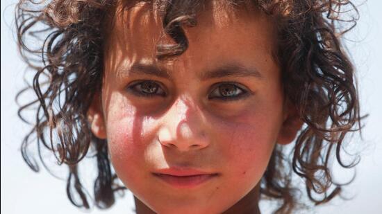 Zar Ghadam, an Afghan girl, poses for a photograph in Kalizei village in the Gayan district of Paktika province of Afghanistan (REUTERS File Photo)