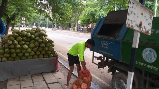 The Chandigarh MC has deployed eight garbage collection vehicles to collect coconut shells from 26 sites across the city. (HT Photo)