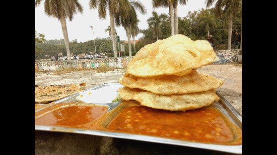 The freshly fried bhaturas feel like mini bites of clouds!