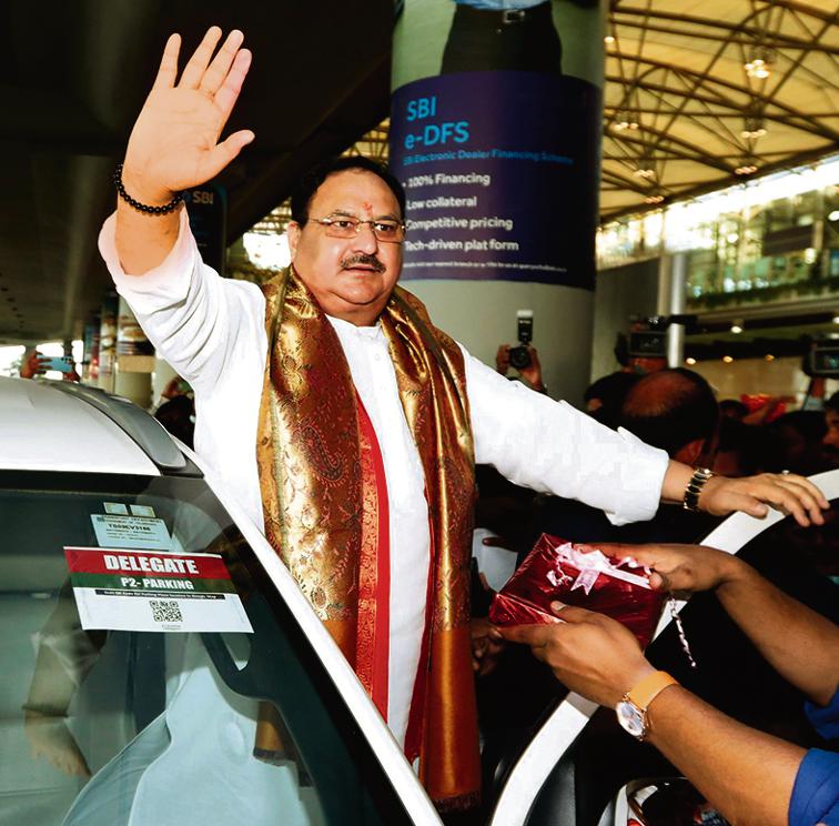 Bharatiya Janata Party (BJP) national president JP Nadda waves to supporters on his arrival at Rajiv Gandhi International Airport, in Hyderabad on Friday. (ANI Photo/Office of JP Nadda Twitter)