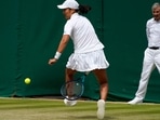 France's Harmony Tan returns to Britain's Katie Boulter during their women's third round singles match on day six of the Wimbledon tennis championships. France's Harmony Tan returns to Britain's Katie Boulter during their women's third round singles match on day six of the Wimbledon tennis championships.