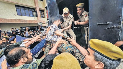 One of the accused in the Udaipur killing outside an NIA court in Jaipur on Saturday. (PTI) One of the accused in the Udaipur killing outside an NIA court in Jaipur on Saturday. (PTI)