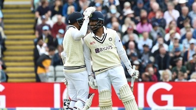 India's Mohammad Siraj, left, reacts with India's Jasprit Bumrah during the second day of the fifth Test (AP)