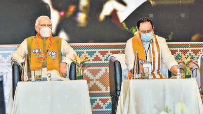 Prime Minister Narendra Modi with BJP National President JP Nadda during the BJP's National Executive meeting in Hyderabad on Saturday. (PTI) Prime Minister Narendra Modi with BJP National President JP Nadda during the BJP's National Executive meeting in Hyderabad on Saturday. (PTI)