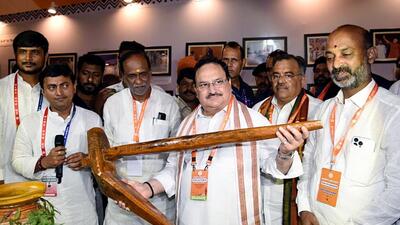 Bharatiya Janata Party (BJP) national president JP Nadda holding a plough during the inauguration of an exhibition at Hotel Novotel in Hyderabad on Friday. (ANI PHOTO.) Bharatiya Janata Party (BJP) national president JP Nadda holding a plough during the inauguration of an exhibition at Hotel Novotel in Hyderabad on Friday. (ANI PHOTO.)
