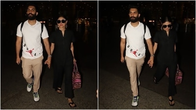 On Friday, the paparazzi clicked Mouni Roy and her husband, Suraj Nambiar, arriving at the Mumbai airport. While Mouni chose an all-black fit, Suraj wore a white T-shirt and beige pants set. The couple smiled for the cameras and posed while holding hands before leaving the airport. (HT Photo/Varinder Chawla) On Friday, the paparazzi clicked Mouni Roy and her husband, Suraj Nambiar, arriving at the Mumbai airport. While Mouni chose an all-black fit, Suraj wore a white T-shirt and beige pants set. The couple smiled for the cameras and posed while holding hands before leaving the airport. (HT Photo/Varinder Chawla)