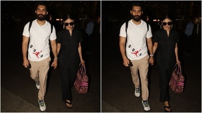 Mouni's black attire features a Mandarin-style collar shirt with a front V split, half sleeves, curved hemline, loose-fitted silhouette and a button-up front. She teamed it with high-waisted pants featuring a flared hem. (HT Photo/Varinder Chawla) Mouni's black attire features a Mandarin-style collar shirt with a front V split, half sleeves, curved hemline, loose-fitted silhouette and a button-up front. She teamed it with high-waisted pants featuring a flared hem. (HT Photo/Varinder Chawla)