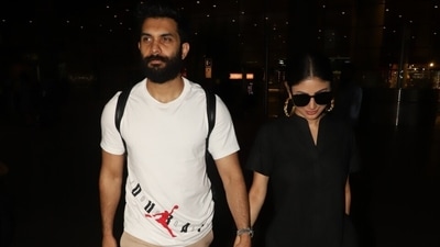 Mouni styled the ensemble with black tinted sunglasses, strapped sandals and trendy gold hoop earrings featuring multi-coloured gemstone embellishments. In the end, a Christian Dior tote bag adorned in pink, white and black-hued patterns added a pop of colour to Mouni's all-black outfit. (HT Photo/Varinder Chawla) Mouni styled the ensemble with black tinted sunglasses, strapped sandals and trendy gold hoop earrings featuring multi-coloured gemstone embellishments. In the end, a Christian Dior tote bag adorned in pink, white and black-hued patterns added a pop of colour to Mouni's all-black outfit. (HT Photo/Varinder Chawla)
