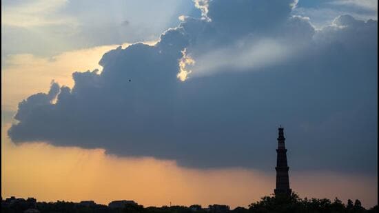 Clouds over the Qutub Minar in Delhi on Saturday. (Amal KS/HT Photo)