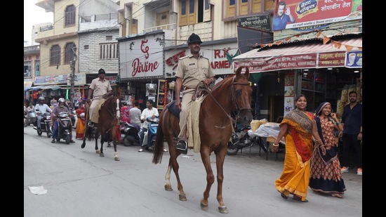 Security personnel patrol during a four-hour relaxation in the curfew imposed by administration to maintain law and order after the murder of tailor Kanhaiya Lal, in Udaipur, Saturday. (PTI)