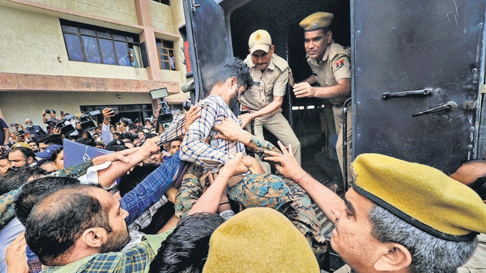 One of the accused in the Udaipur killing outside an NIA court in Jaipur on Saturday. (PTI) One of the accused in the Udaipur killing outside an NIA court in Jaipur on Saturday. (PTI)